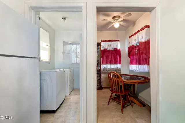 a view of a balcony with red and white furniture