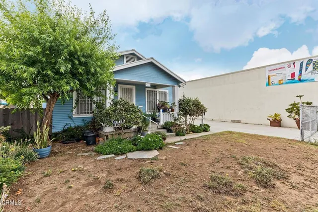 a house with trees in front of it