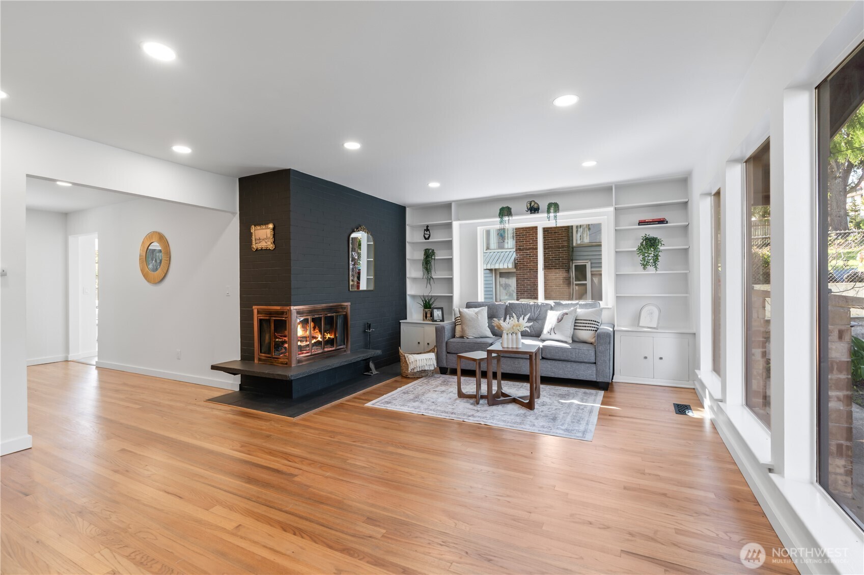 211 Southwest Langston Road Renton, WA 98057 - Photo 6 of 35 a living room with furniture and a wooden floor