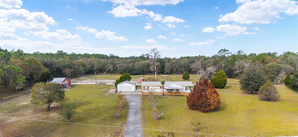 5150 Southeast 117th Avenue Morriston, FL 32668 - Photo 1 of 63 a view of a swimming pool with a mountain view