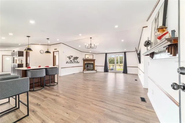 a view of a kitchen with furniture and a chandelier