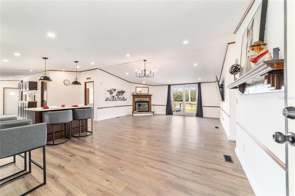 5150 Southeast 117th Avenue Morriston, FL 32668 - Photo 12 of 63 a view of an entryway with wooden floor