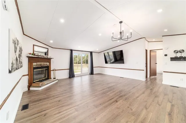a kitchen with stainless steel appliances granite countertop a sink stove and wooden floor