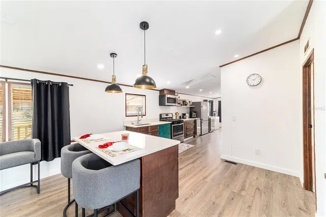 a kitchen with stainless steel appliances granite countertop lots of counter top space and cabinets
