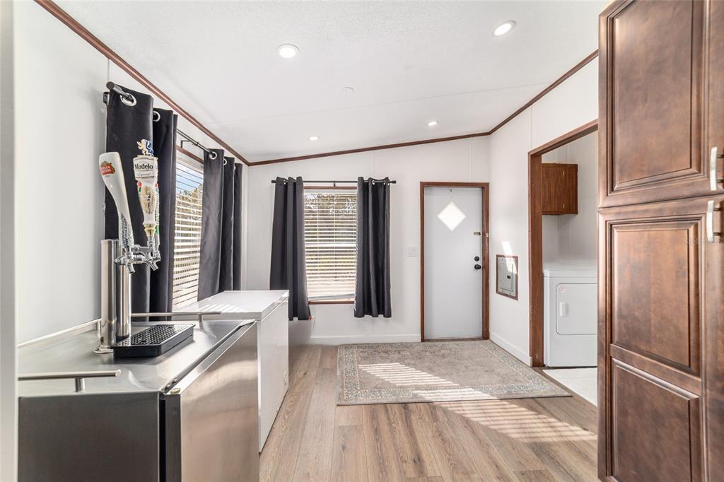 5150 Southeast 117th Avenue Morriston, FL 32668 - Photo 25 of 63 a view of a kitchen with a sink and refrigerator