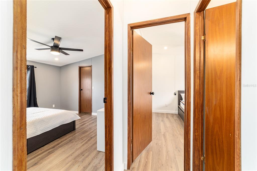 5150 Southeast 117th Avenue Morriston, FL 32668 - Photo 36 of 63 a bedroom with a bed and a chandelier