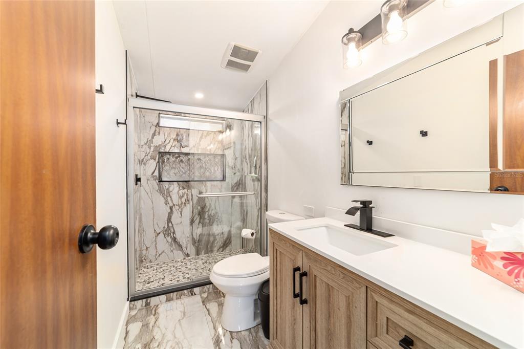 5150 Southeast 117th Avenue Morriston, FL 32668 - Photo 39 of 63 a bathroom with a sink toilet and shower