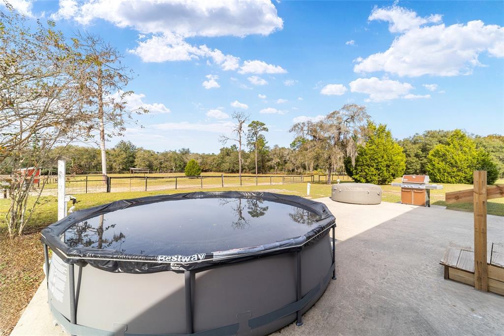 5150 Southeast 117th Avenue Morriston, FL 32668 - Photo 43 of 63 a view of swimming pool with an outdoor seating
