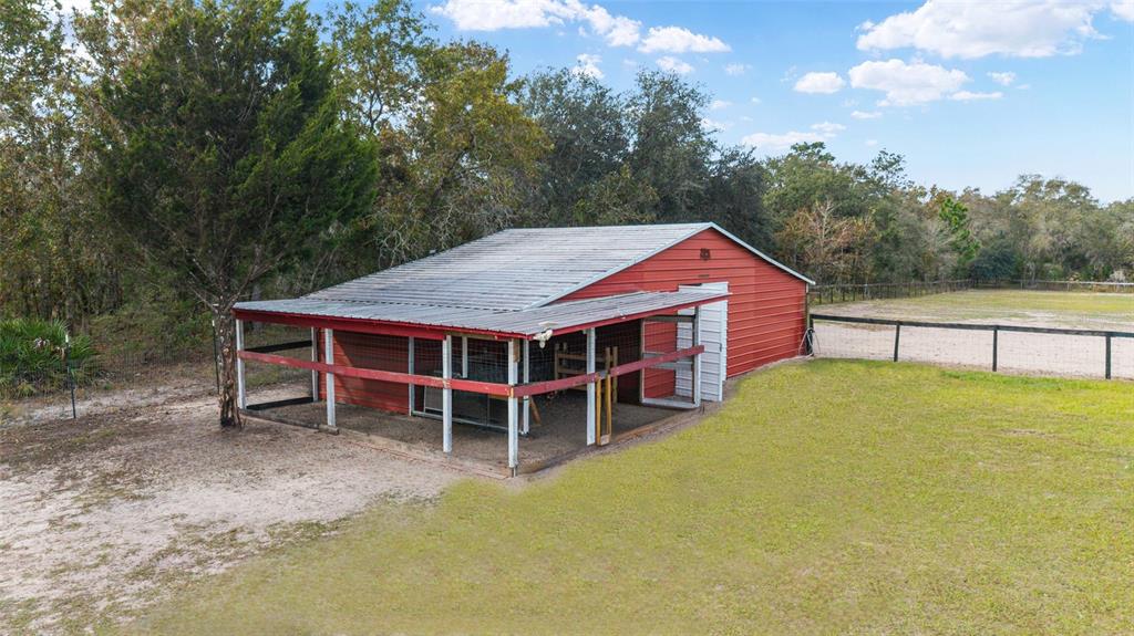 5150 Southeast 117th Avenue Morriston, FL 32668 - Photo 47 of 63 a view of a house with a backyard