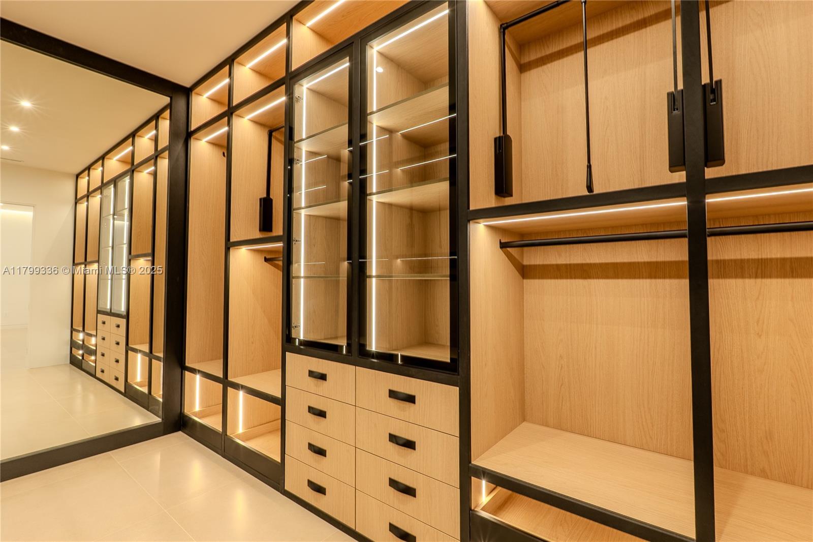 4231 Southwest 10th Street Miami, FL 33134 - Photo 16 of 35 a view of walk in closet with empty racks