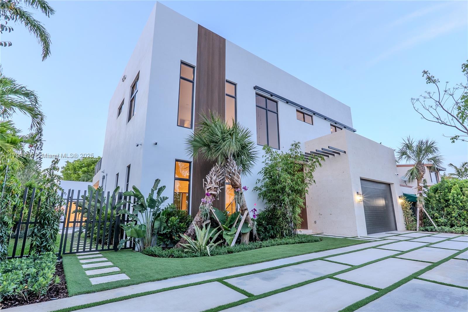 4231 Southwest 10th Street Miami, FL 33134 - Photo 2 of 35 a front view of a house with a yard and trees