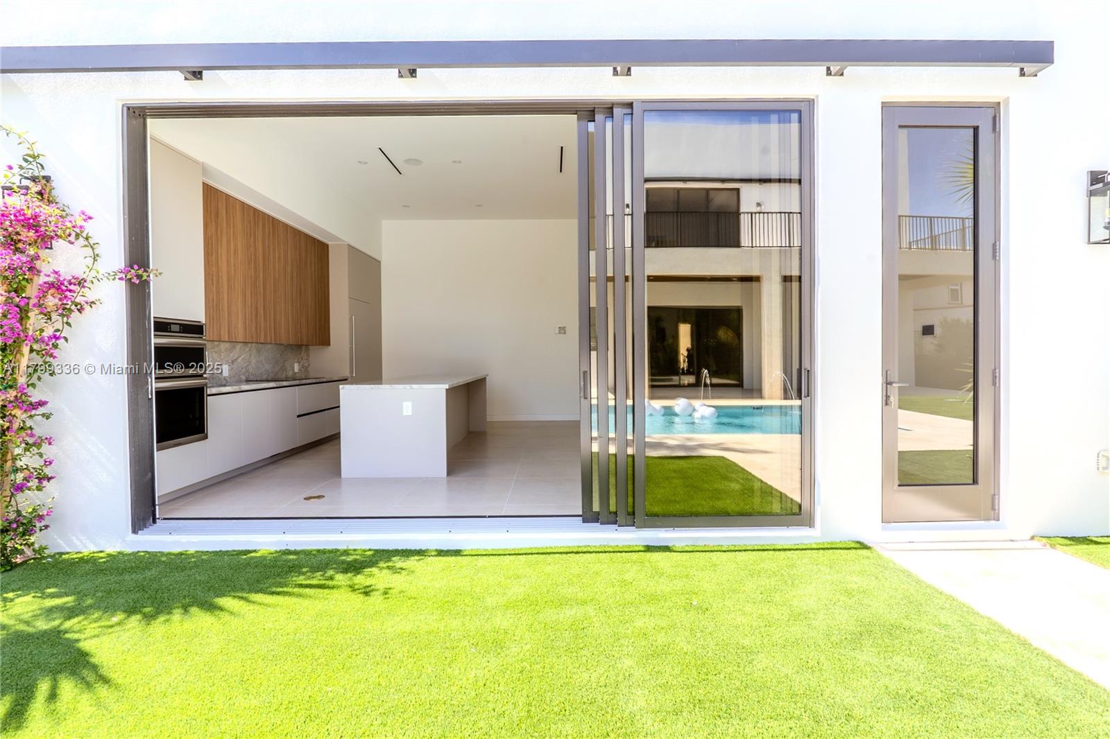 4231 Southwest 10th Street Miami, FL 33134 - Photo 29 of 35 a living room with a fireplace and entryway