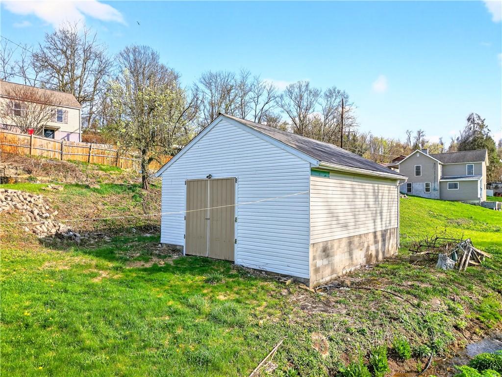 93 Old 51 Road Perryopolis, PA 15473 - Photo 36 of 44 a front view of a house with garden