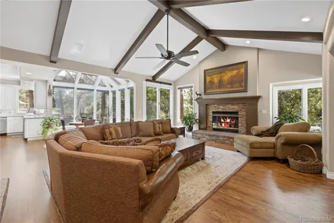 a bathroom with a granite countertop sink and a large mirror