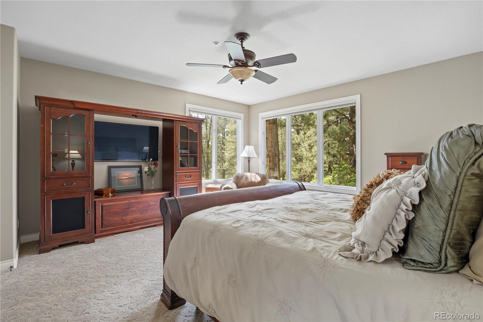 315 Prospect Drive Castle Rock, CO 80108 - Photo 16 of 45 a bed sitting in a spacious bedroom next to a window