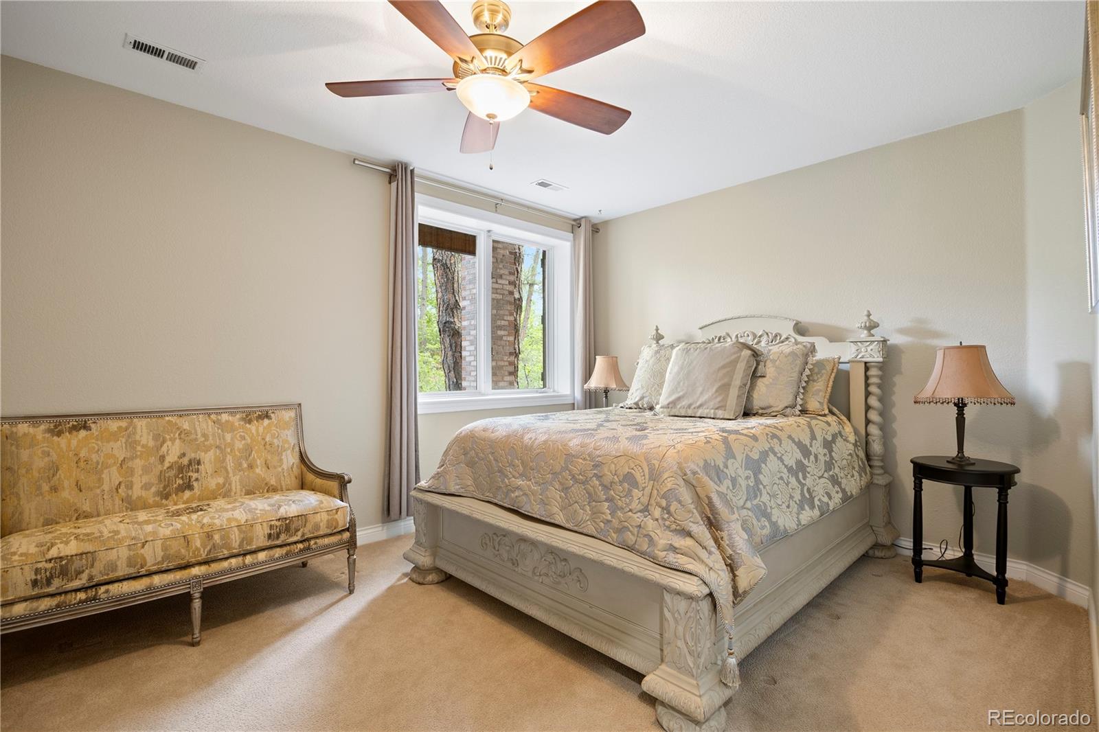 315 Prospect Drive Castle Rock, CO 80108 - Photo 32 of 45 a bedroom with a bed and a chandelier