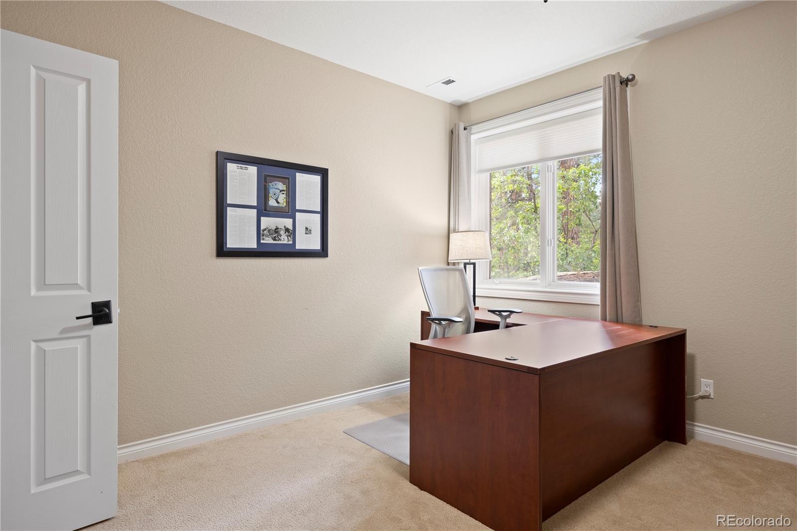 315 Prospect Drive Castle Rock, CO 80108 - Photo 34 of 45 a bath room with a sink tub and a window