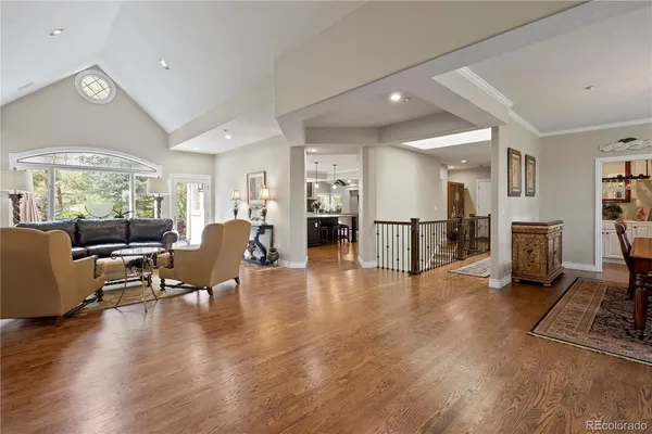 a view of a hallway and wooden floor