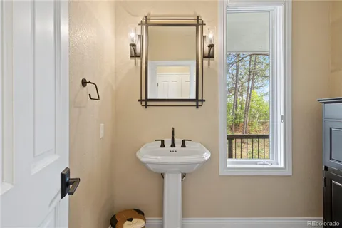 a view of a hallway and wooden floor