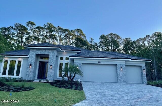 a view of a house with a yard and plants