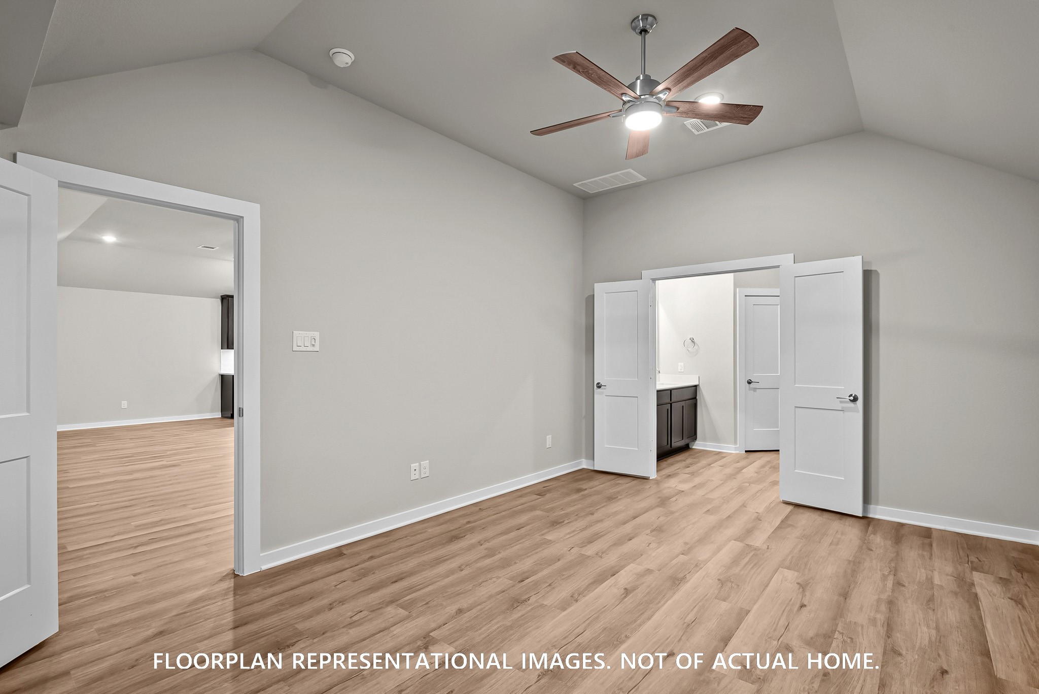 213 Draper Shadows Drive Willis, TX 77378 - Photo 11 of 19 an empty room with wooden floor and a ceiling fan