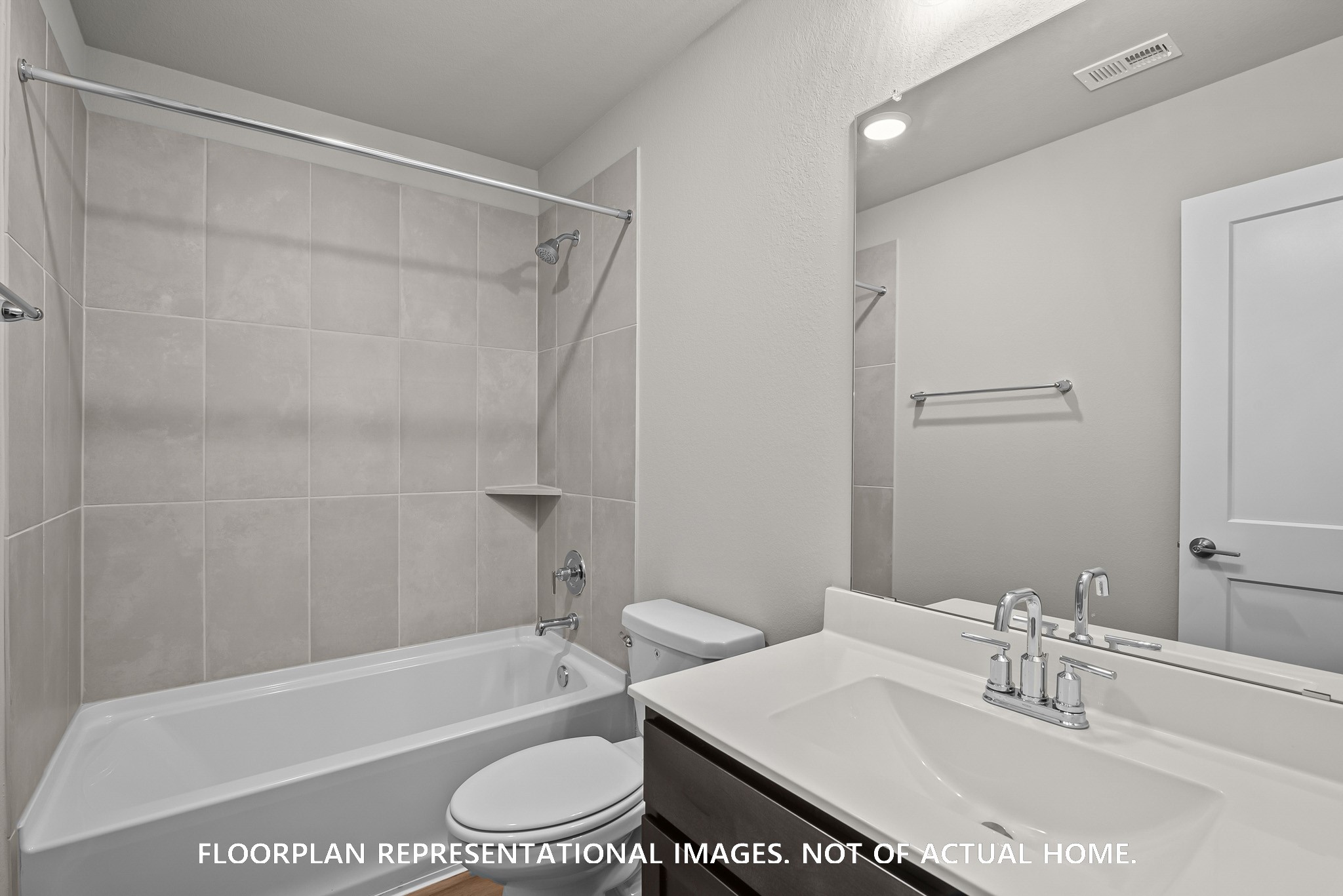 213 Draper Shadows Drive Willis, TX 77378 - Photo 14 of 19 a bathroom with a sink toilet and shower