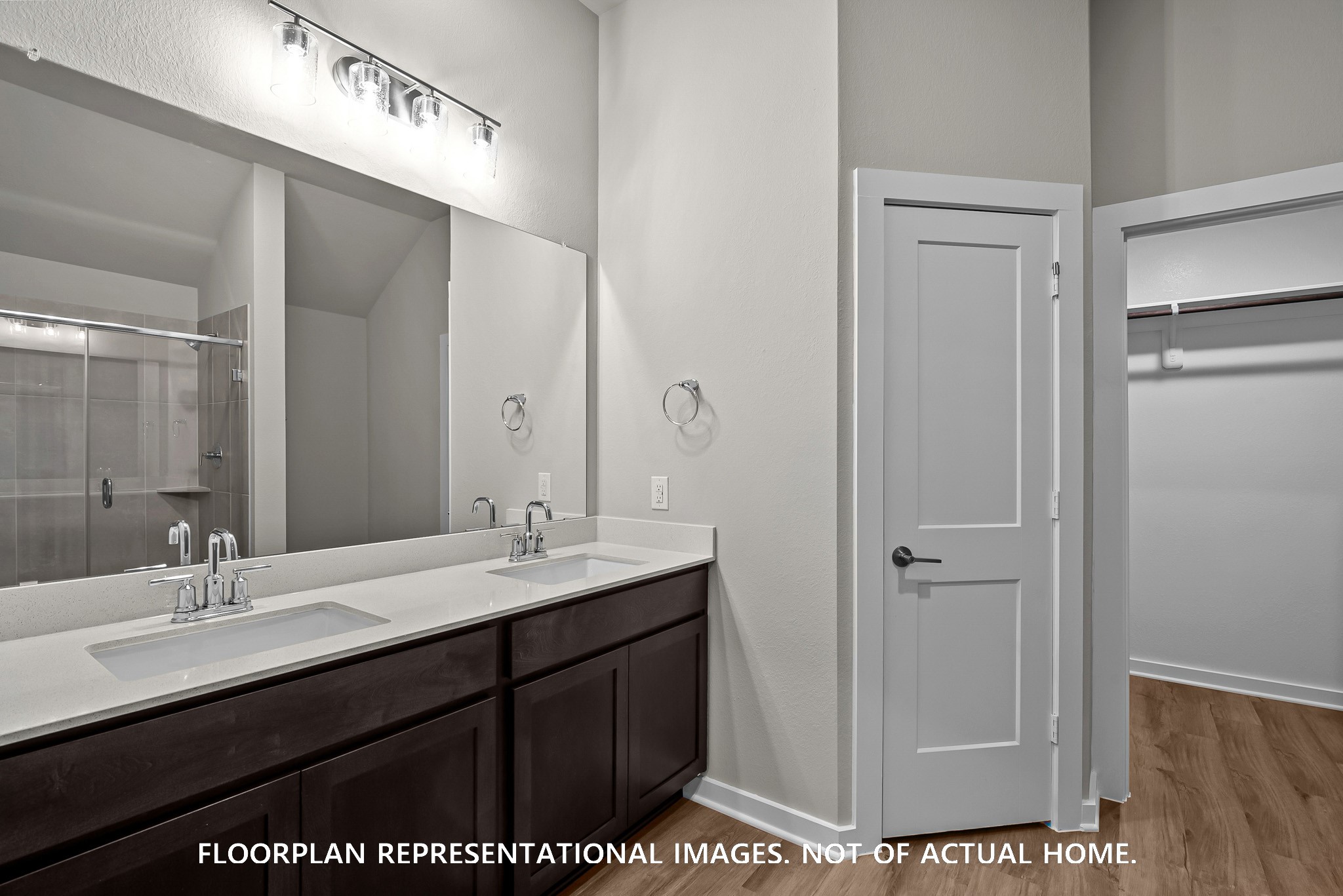 213 Draper Shadows Drive Willis, TX 77378 - Photo 10 of 19 a bathroom with a sink a mirror and a shower