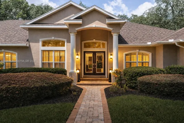 a front view of a house with yard