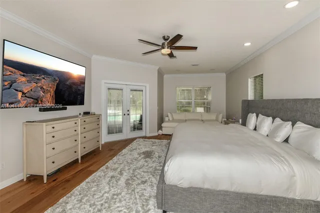 a kitchen with stainless steel appliances kitchen island granite countertop a refrigerator and a sink