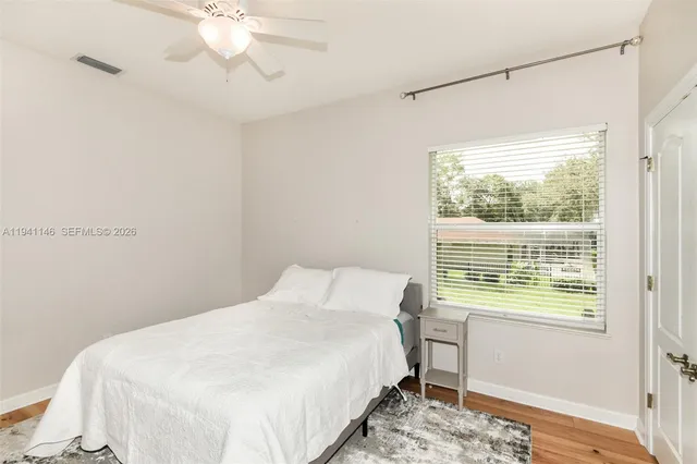 a view of a backyard with sitting area