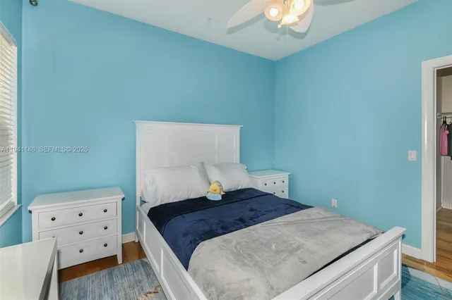 a front view of a house with a garden and plants