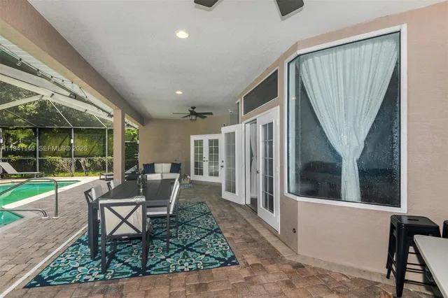 a aerial view of a house with yard and green space