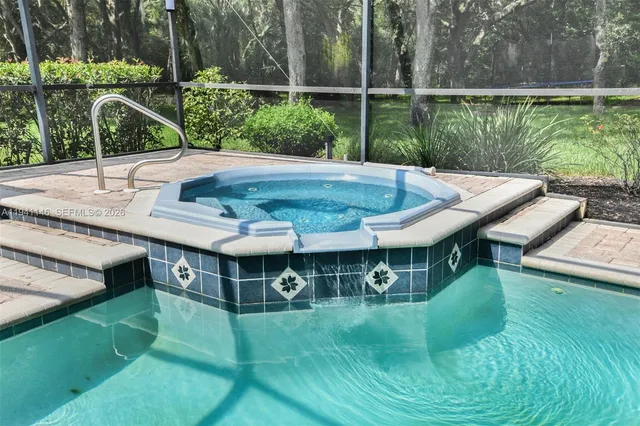 an aerial view of a house with outdoor space swimming pool and outdoor seating