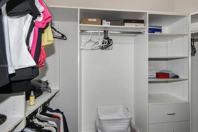 a room with pool table and windows