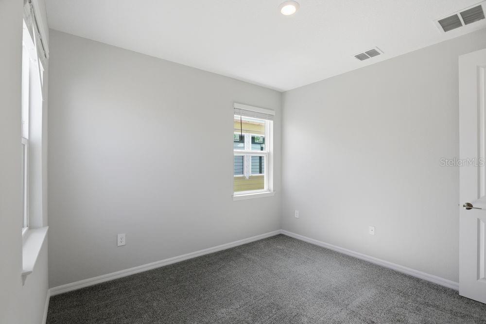 1014 Top Minnow Road St. Cloud, FL 34771 - Photo 14 of 39 an empty room with a window