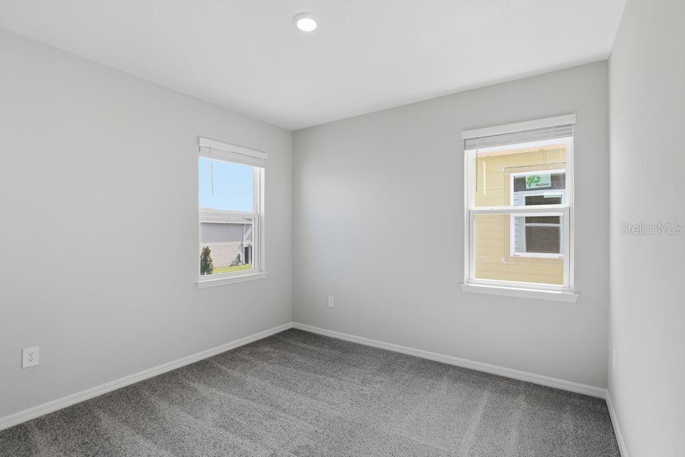 1014 Top Minnow Road St. Cloud, FL 34771 - Photo 15 of 39 an empty room with a window