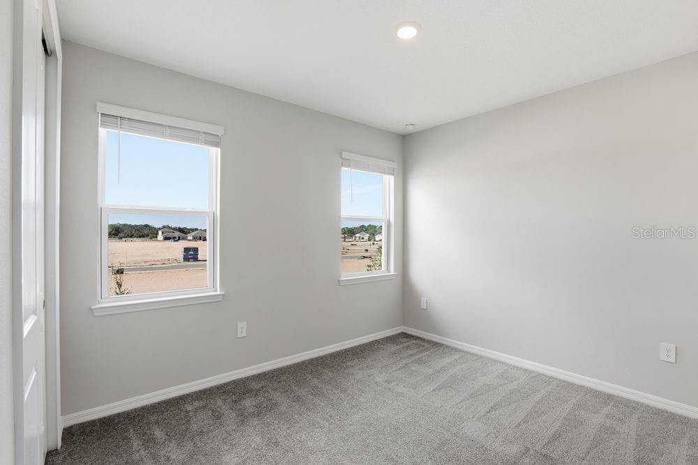 1014 Top Minnow Road St. Cloud, FL 34771 - Photo 17 of 39 an empty room with a window