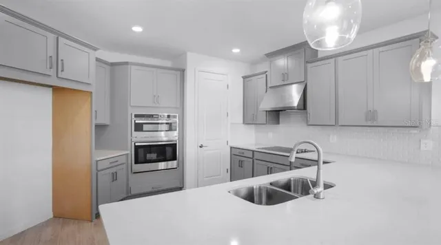 a kitchen with a sink and window