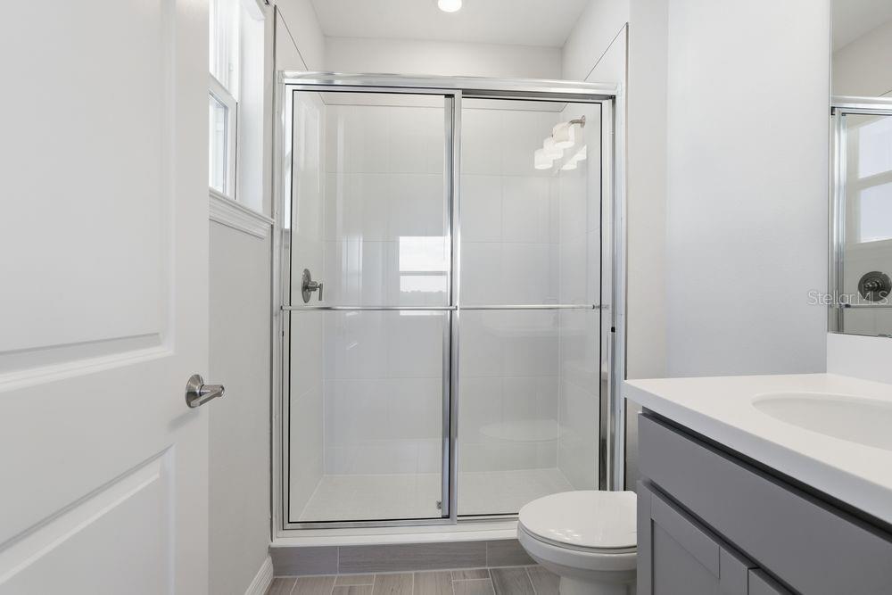 1014 Top Minnow Road St. Cloud, FL 34771 - Photo 23 of 39 a bathroom with a shower and a toilet