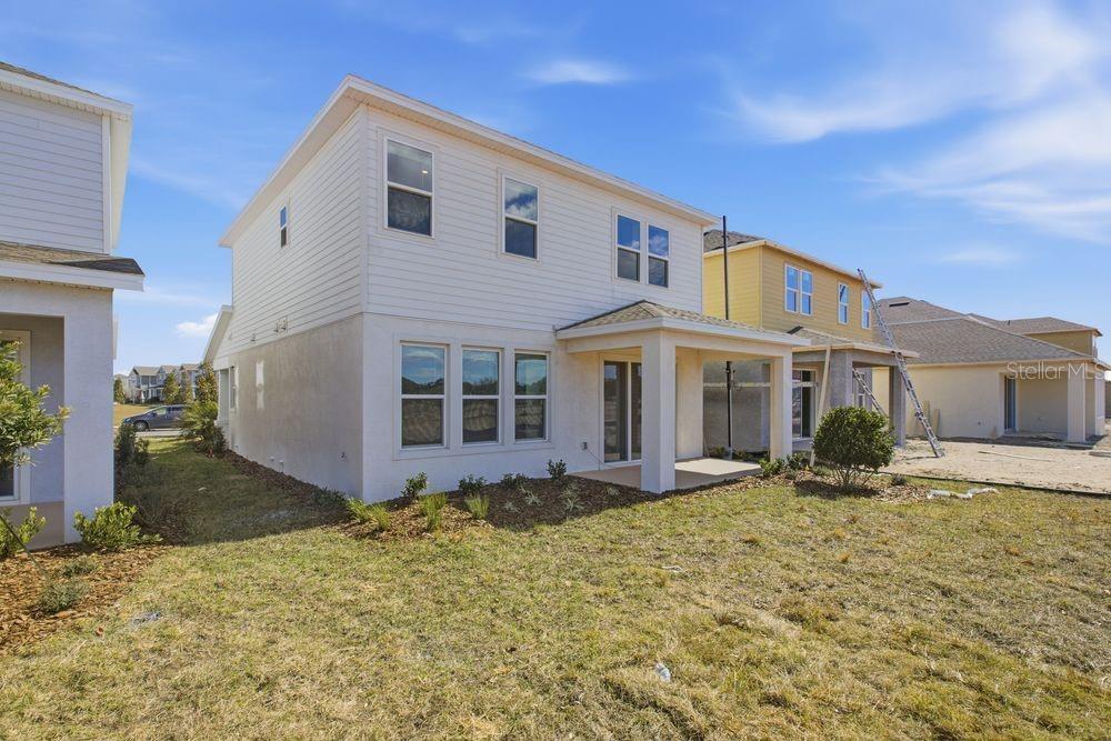 1014 Top Minnow Road St. Cloud, FL 34771 - Photo 29 of 39 a front view of a house with yard and parking