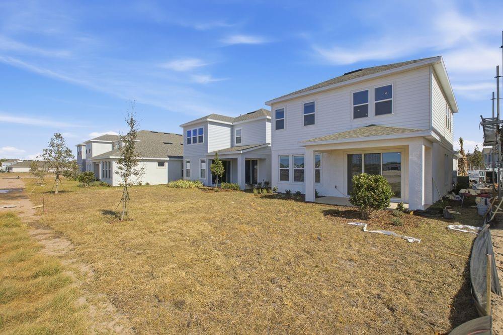 1014 Top Minnow Road St. Cloud, FL 34771 - Photo 30 of 39 a front view of a house with a yard