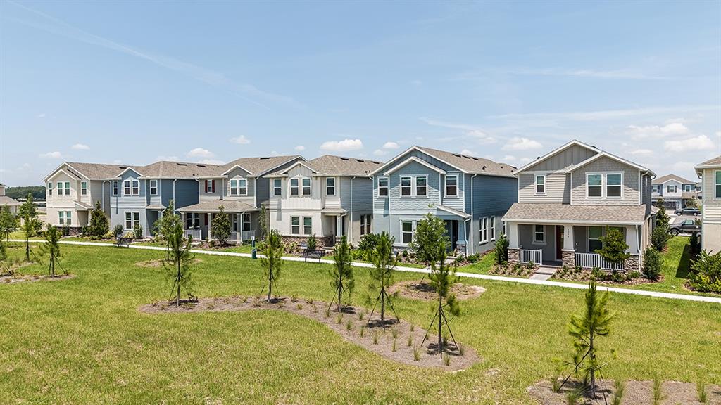 1014 Top Minnow Road St. Cloud, FL 34771 - Photo 35 of 39 a front view of a house with a yard table and chairs