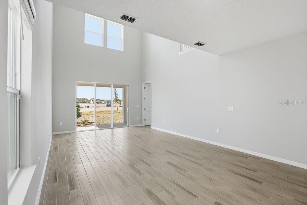 1014 Top Minnow Road St. Cloud, FL 34771 - Photo 6 of 39 a view of a room with wooden floor