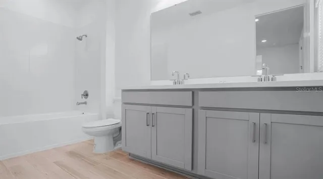 a bathroom with a toilet and a sink