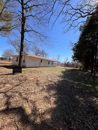 a view of a backyard of the house