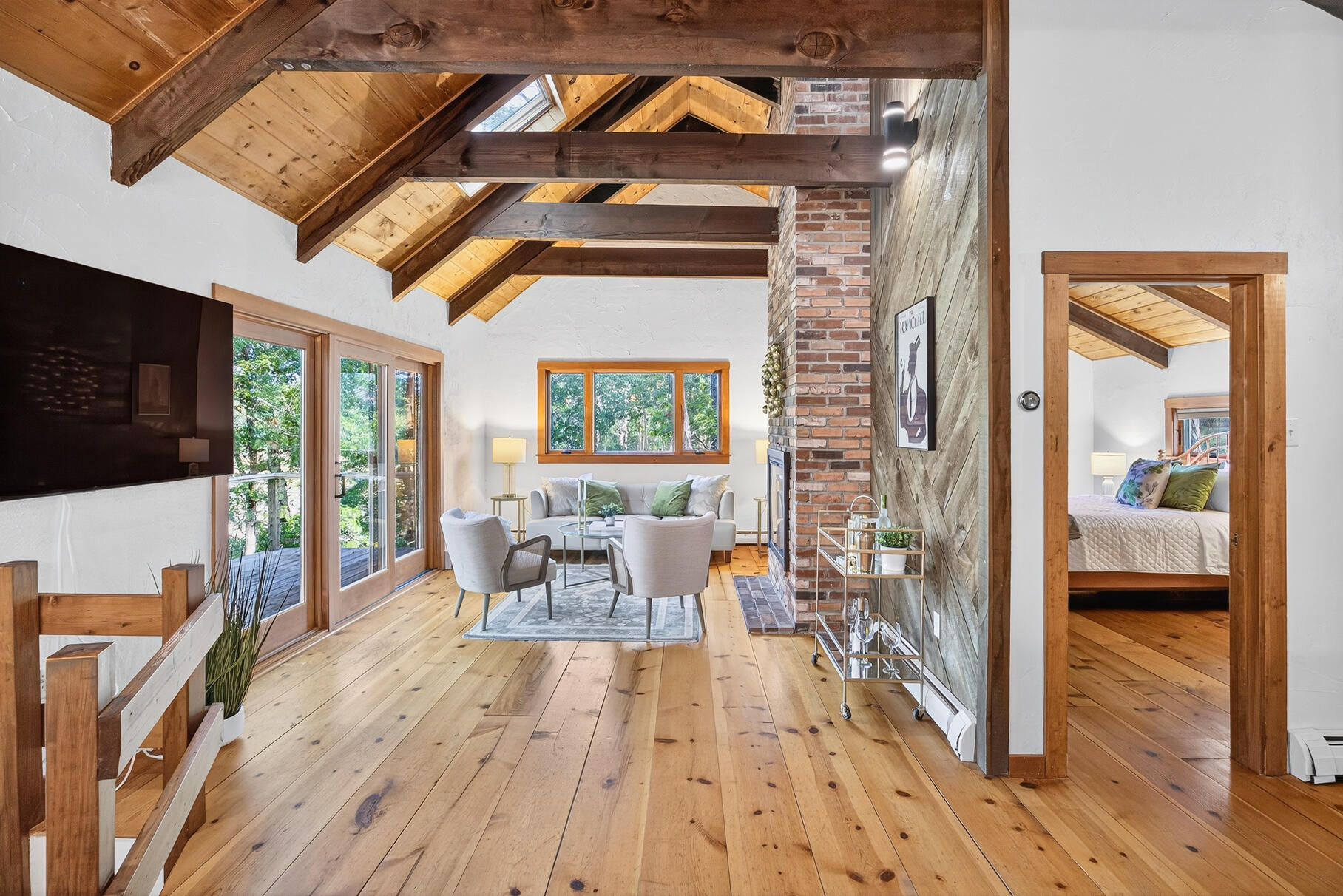 90 Blue Heron Road Wellfleet, MA 02667 - Photo 11 of 54 a view of living room kitchen with furniture and flat screen tv