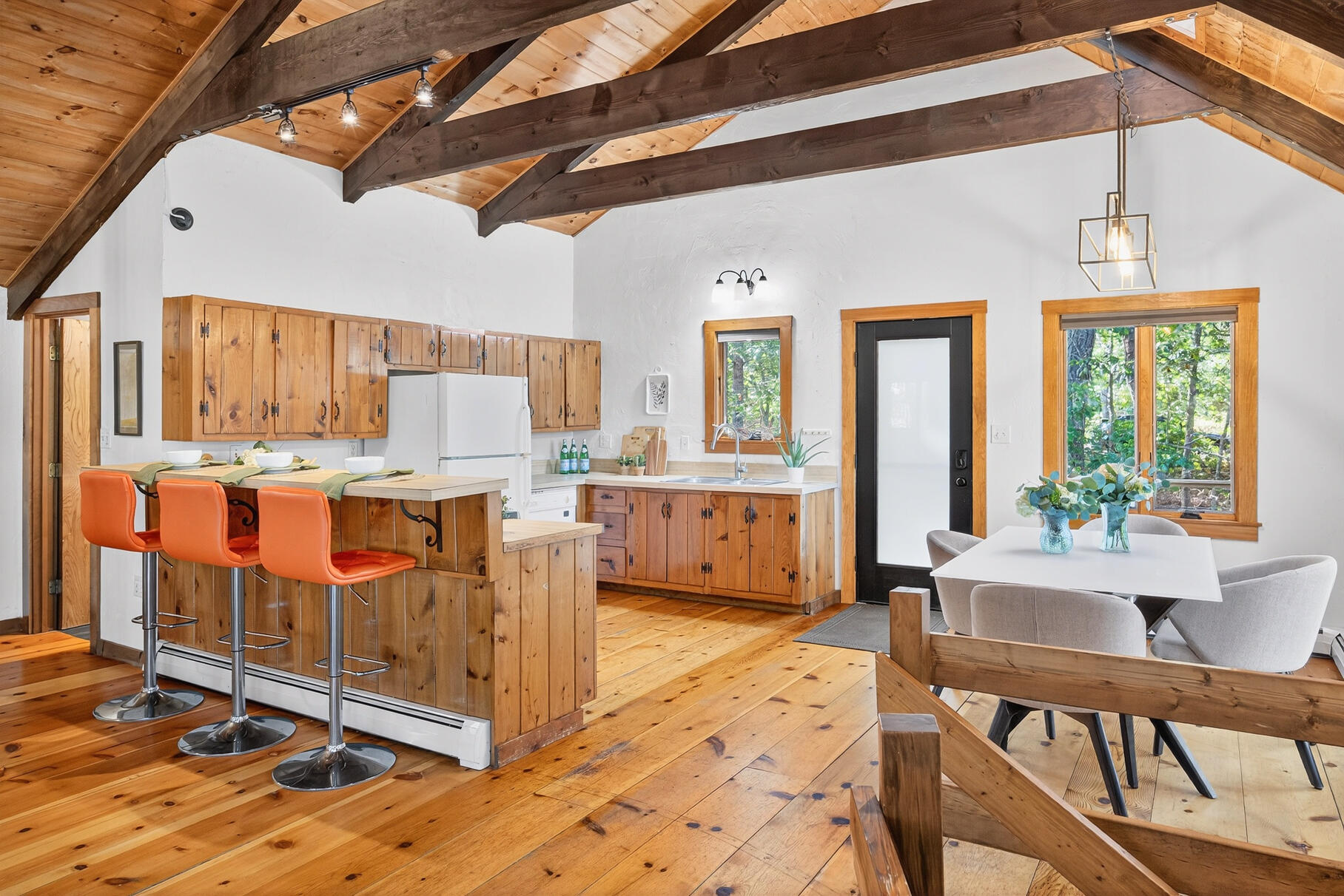 90 Blue Heron Road Wellfleet, MA 02667 - Photo 13 of 54 a view of a kitchen with kitchen island granite countertop lots of counter top space and glass door