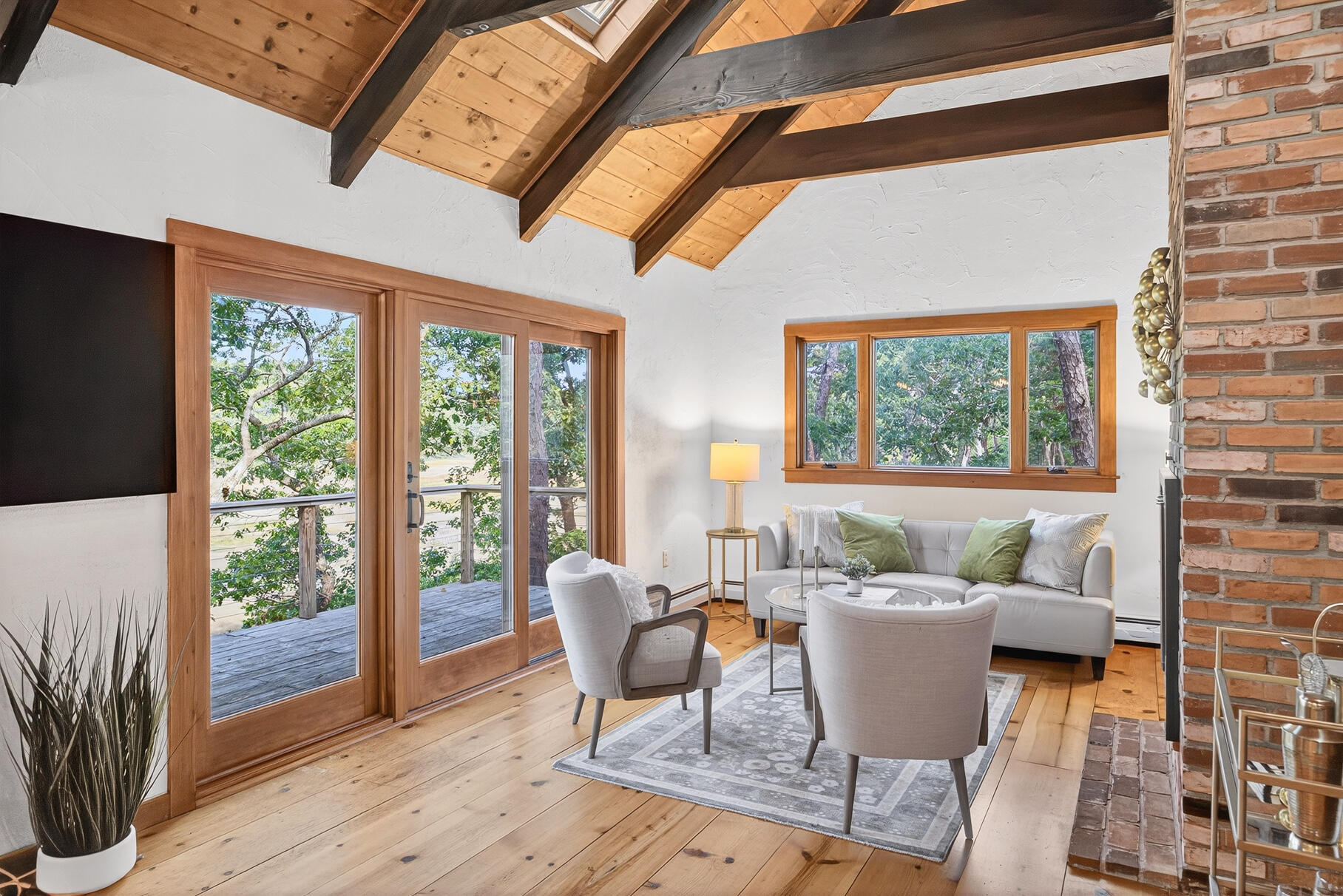 90 Blue Heron Road Wellfleet, MA 02667 - Photo 17 of 54 a dining room with furniture wooden floor and a potted plant