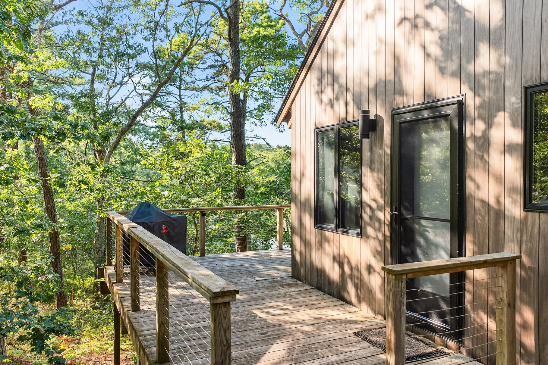 90 Blue Heron Road Wellfleet, MA 02667 - Photo 2 of 54 a view of balcony with wooden floor and fence