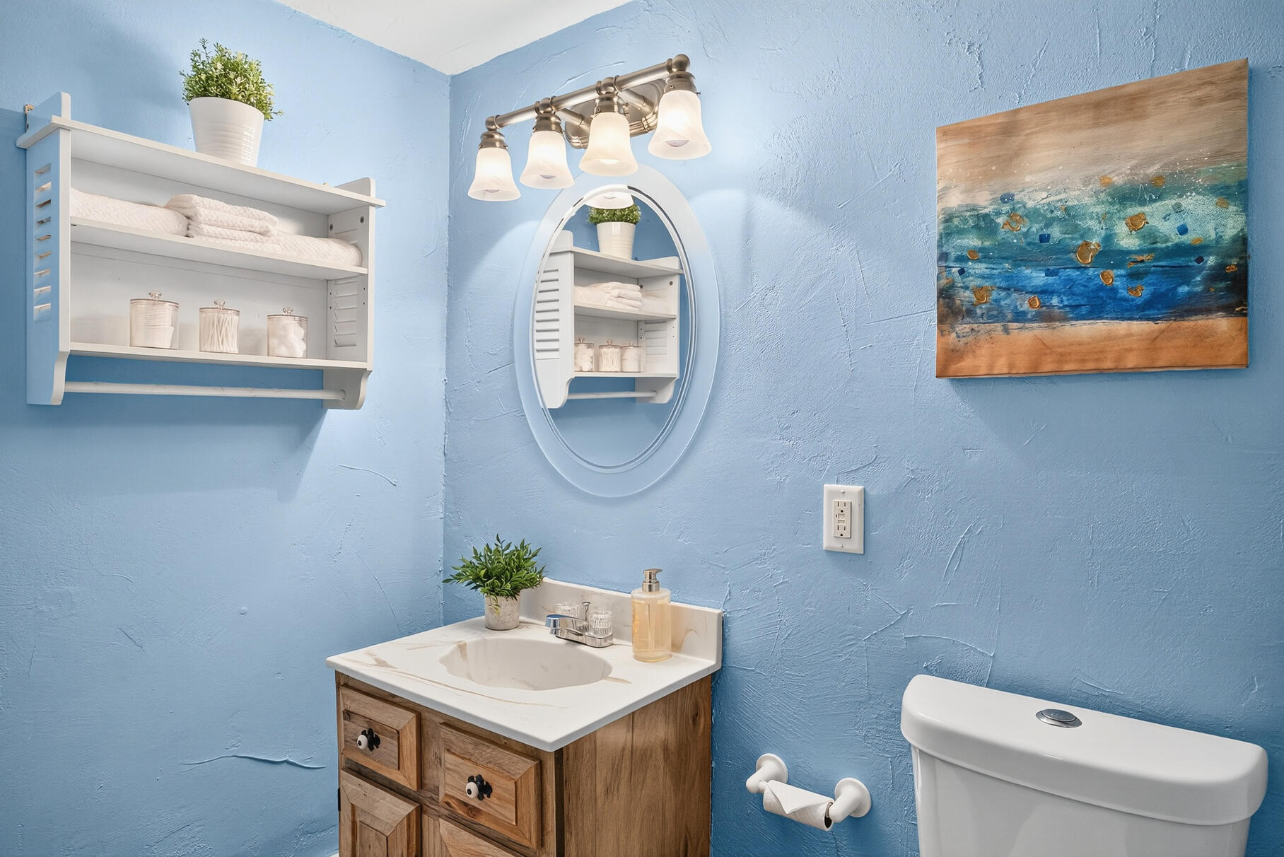 90 Blue Heron Road Wellfleet, MA 02667 - Photo 36 of 54 a bathroom with a toilet a sink and a mirror